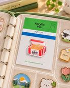 Soar on Wings Fried Chicken Wings acrylic pin on backing card in a pin collection
