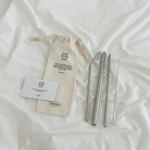 Stainless steel straw set with a canvas pouch featuring the message "God loves you" and a Bible verse from Jeremiah 31:3, including a cleaning brush.