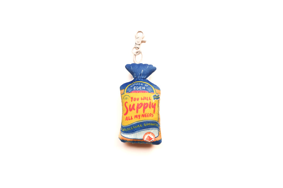 Supply Bread plushie keychain with bread packet-inspired design and “You will supply all my needs” detail.