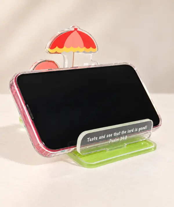 Taste and See acrylic phone stand holding a smartphone in landscape orientation