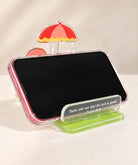 Taste and See acrylic phone stand holding a smartphone in landscape orientation