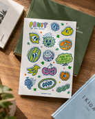 The Good Fruit Series sticker sheet with colourful fruit illustrations styled on books, designed by Thir.st in collaboration with The Commandment Co.