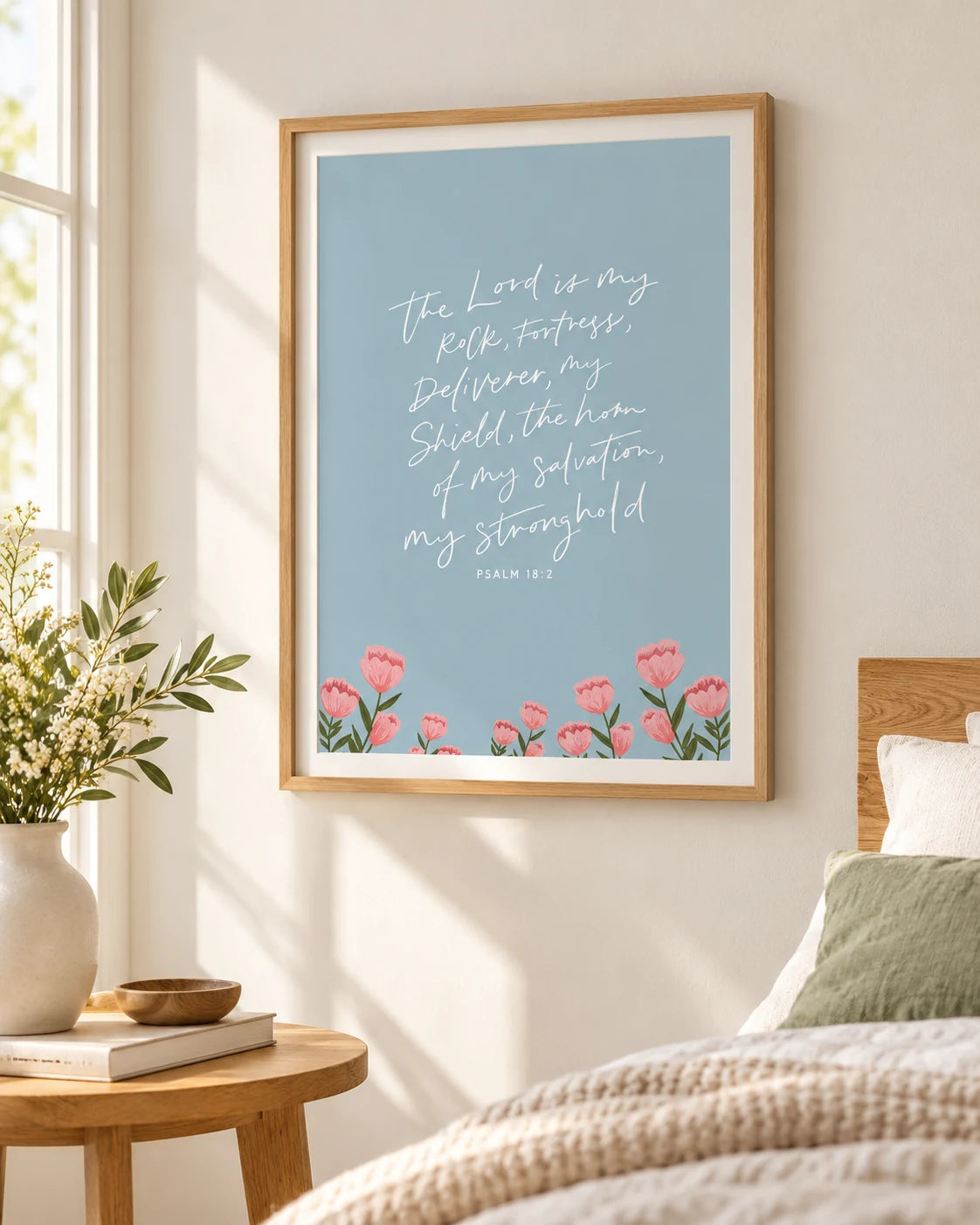 The Lord Is My Rock Psalm 18:2 floral blue Christian poster displayed in a natural wooden frame in a sunlit bedroom