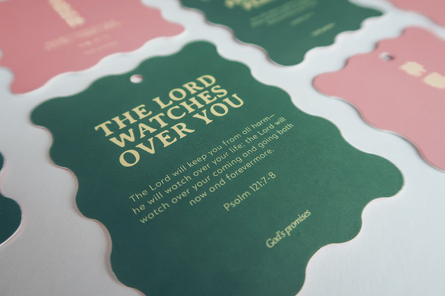 "Christian Christmas tree hanging ornaments or bookmarks featuring the Bible verse 'The Lord Watches Over You' from Psalm 121:7-8, with a green scalloped design and gold text.