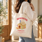 The New Has Come customisable baptism tote bag carried over the shoulder in a bright sunlit interior.