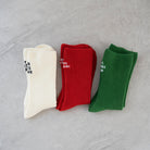 Three ribbed socks in white, red, and green with white embroidery; features uplifting Christian phrases “Always Hallelujah” and “Always Be Grateful” for a daily faith reminder.