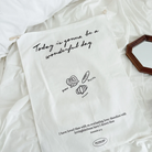 Uplifting wall tapestry with the message "Today is gonna be a wonderful day," featuring hand-drawn pretzel, baguette, and croissant illustrations, and Jeremiah 31:3 Bible verse, perfect for Christian home decor.