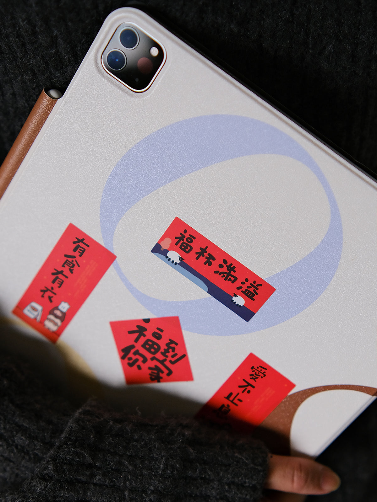 Mini Chinese New Year couplet stickers applied on tablet case for festive CNY decoration