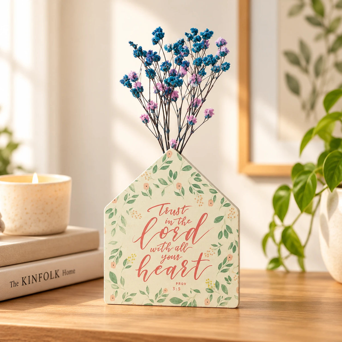Trust in the Lord little house vase with blue and purple flowers on a wooden table