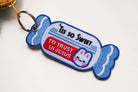 Close-up of candy-shaped embroidered Christian keychain featuring “Truth – God’s Word”