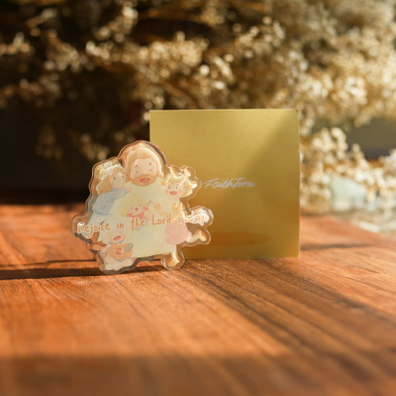 Decorative Christian Magnet: "Decorative Christian magnet on a green fridge with an illustration and the phrase 'Rejoice in the Lord always'"