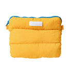 A vibrant yellow Pong Pong Bag with a blue zipper, showcasing its compact and versatile design for everyday use.