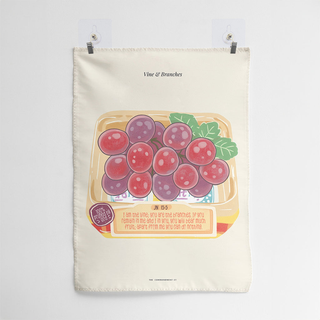 Wall tapestry featuring 'Vine and Branches' design with a box of grapes and leaves, including the Bible verse John 15:5: 'I am the vine; you are the branches. If you remain in me and I in you, you will bear much fruit; apart from me you can do nothing.'