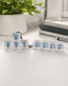 Walk Abide Seek Dwell and PRAY light-up keycap keychains together