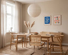Walk Light Love Deep blue Christian poster displayed beside Worry Less Worship More wall art in a warm neutral dining room
