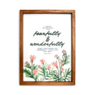 A wooden-framed wall art featuring the Bible verse "I praise you because I am fearfully and wonderfully made; your works are wonderful, I know that full well" from Psalm 139:14, adorned with floral illustrations for a faith-inspired decorative piece.