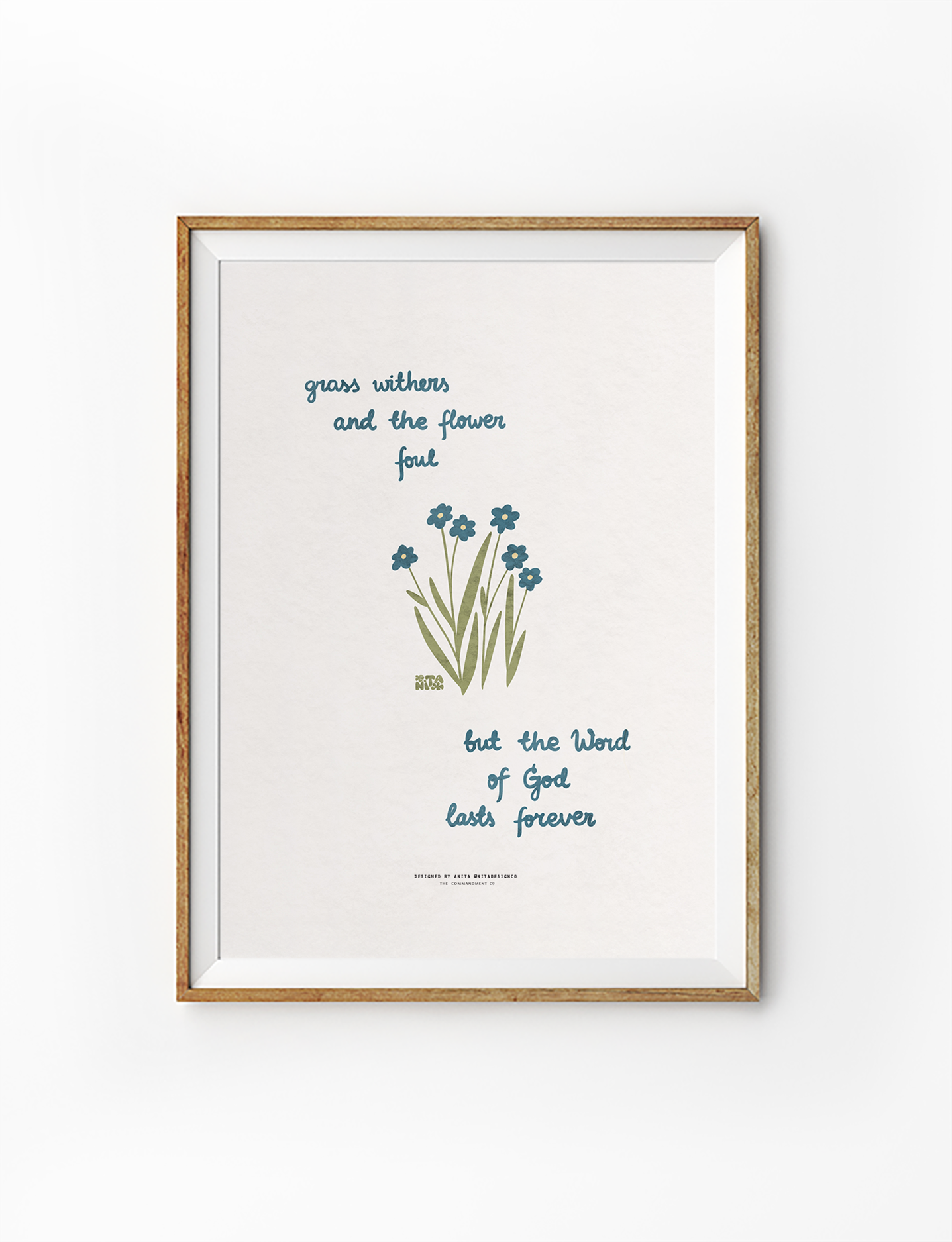 Inspirational Christian poster in a wooden frame with the words "grass withers and the flower fall, but the Word of God lasts forever," featuring simple blue flowers and green grass, reflecting faith and simple happiness.