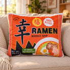 Xin Blessed Ramen plush toy styled on a cosy sofa in a sunlit living room