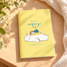 Yes Jesus Sayangs Me A5 Christian notebook styled on a warm sunlit wooden table.