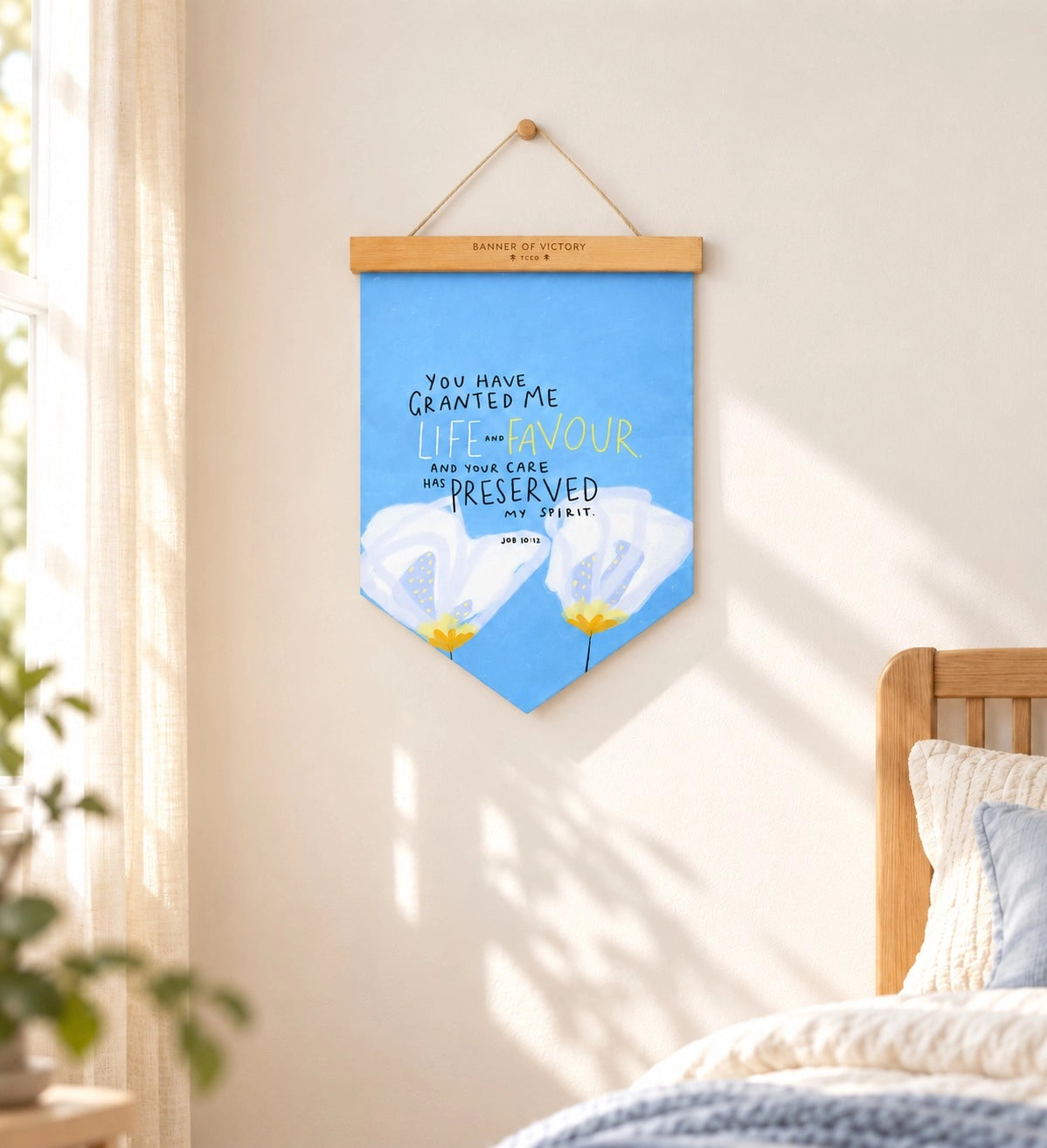 You Have Granted Me Life And Favour Banner of Victory displayed in a bright sunlit bedroom.