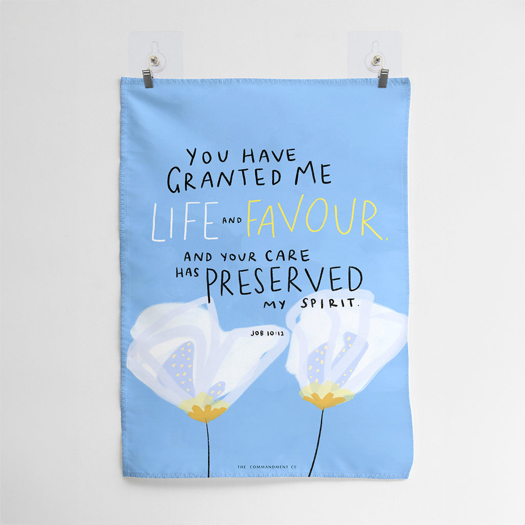 Christian wall art featuring the Bible verse 'You Have Granted Me Life and Favour' from Job 10:12, with a blue background and white floral illustration.