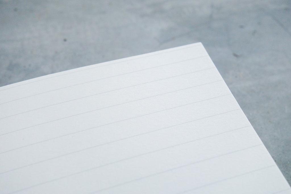 horizontal lined pages of notebook