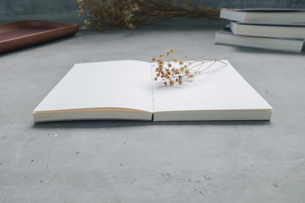 Notebook lays flat when parted in the centre for easy sketching and writing. Decorated with dried baby's breath.