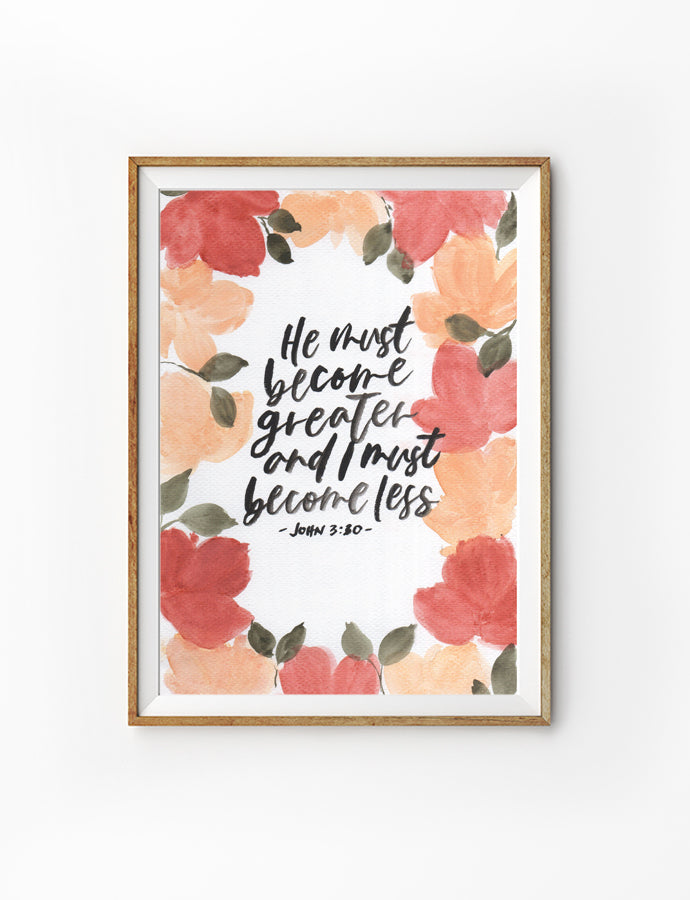 Poster featuring typography bible verses with flowers designs ‘He must become greater and I must become less’ is hung on the wall in a gold photo frame. 200GSM paper, available in A3,A4 size.