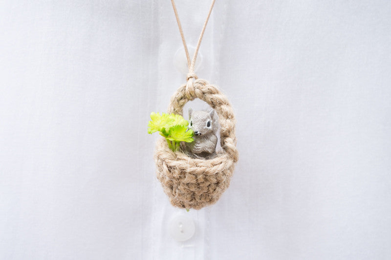 Cute squirrel necklace in an acorn with leaves