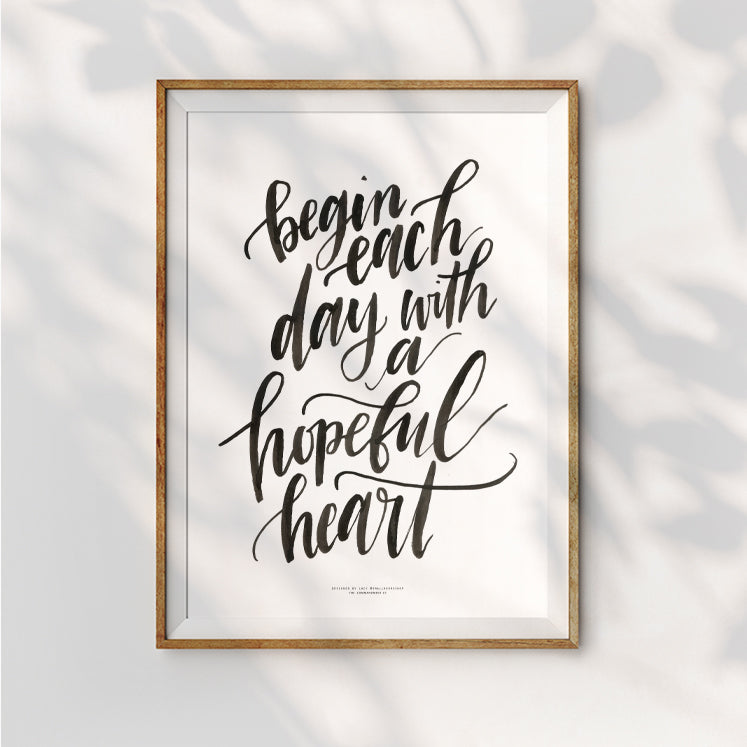 Inspiration and encouraging wall art poster that says "begin each day with a hopeful heart"