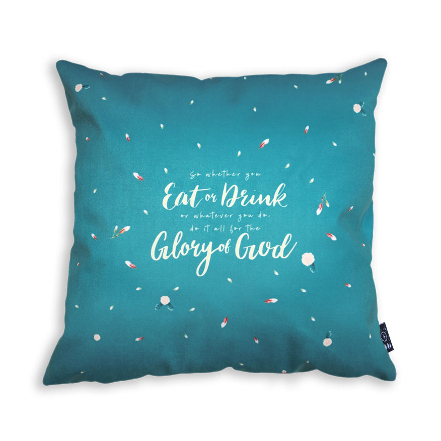 The back of the cushion cover features petals design on light blue background and the verse