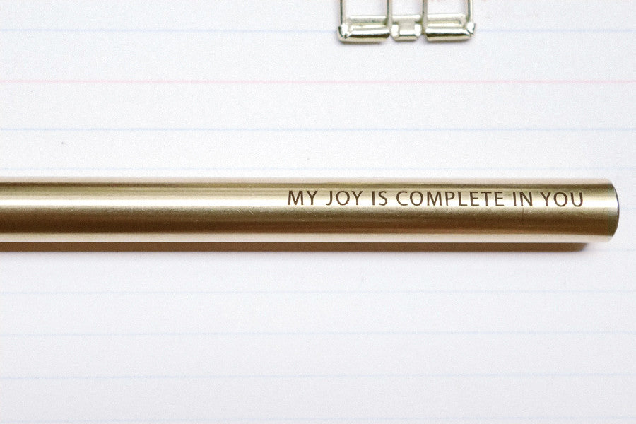 Brass pen barrel with the message 'My joy is complete in you'.