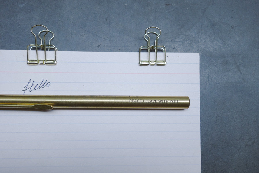 Brass pen barrel with the message 'Peace I leave with you'.
