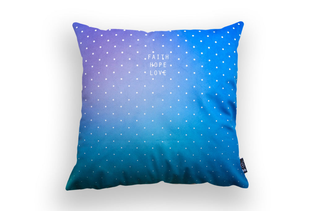 The back of cushion cover features blue sky ombre background with polkadot and the verse 'faith hope love'.