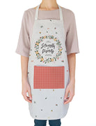 White apron with floral details. 'She is clothed with strength and dignity'. Gift it to your favourite home chef!