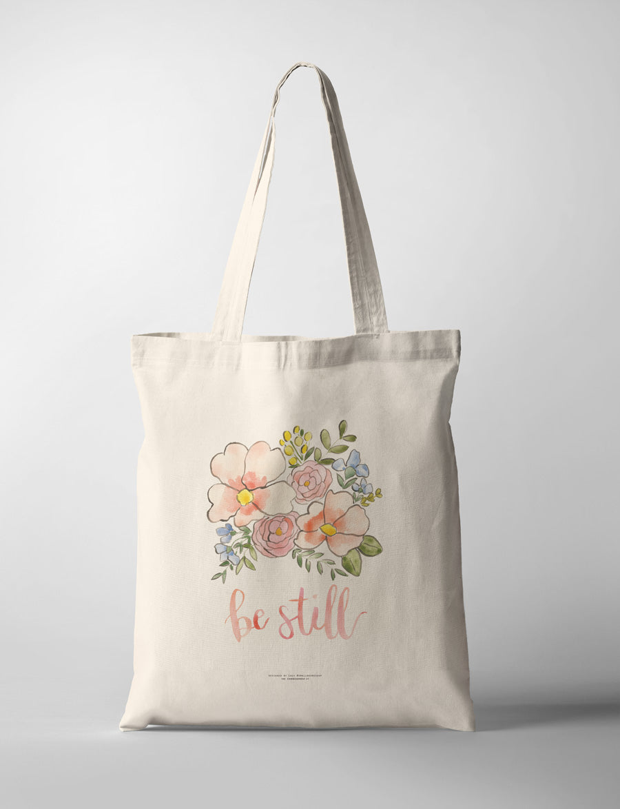 Be Still Christian tote bag with floral bouquet design by Small Hours Shop.