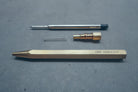 Hex II Classic brass ballpoint pen dismantled components.