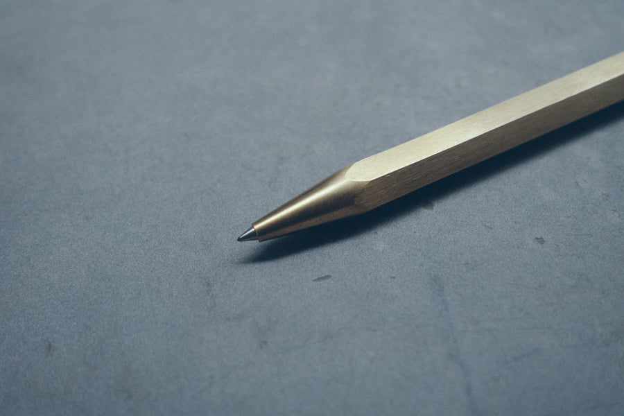 Hex II Classic brass ballpoint pen tip detail.