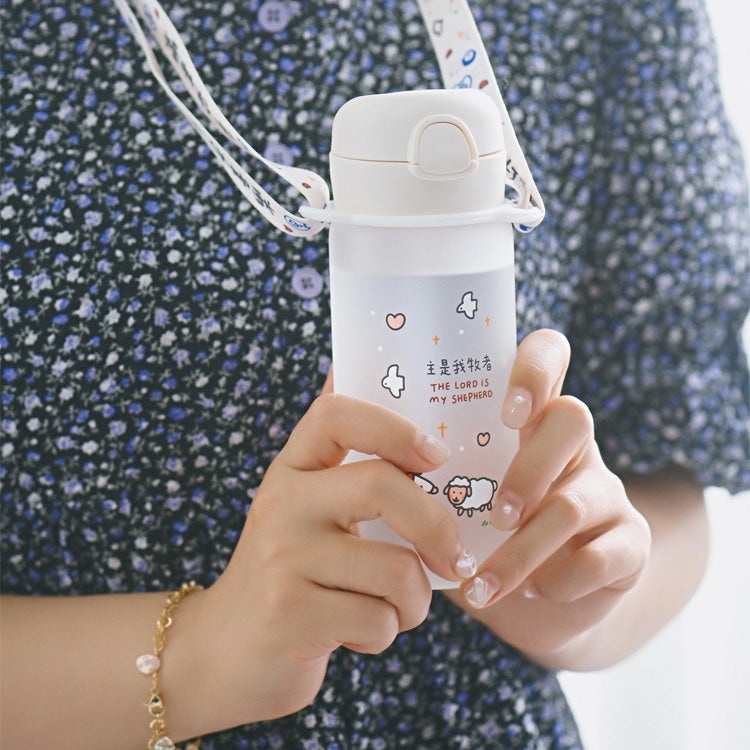 Do Not Worry glass travel tumbler with lanyard for carrying.