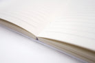 Don't Paiseh A5 lined Christian notebook showing stitched binding and interior pages.