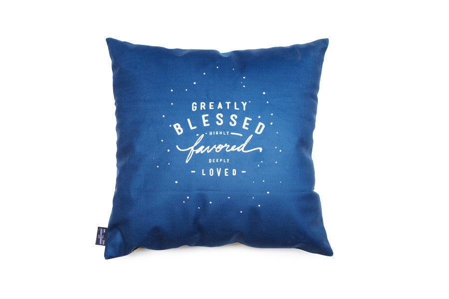 Greatly Blessed Highly Favored Deeply Loved cushion cover styled in a home setting.