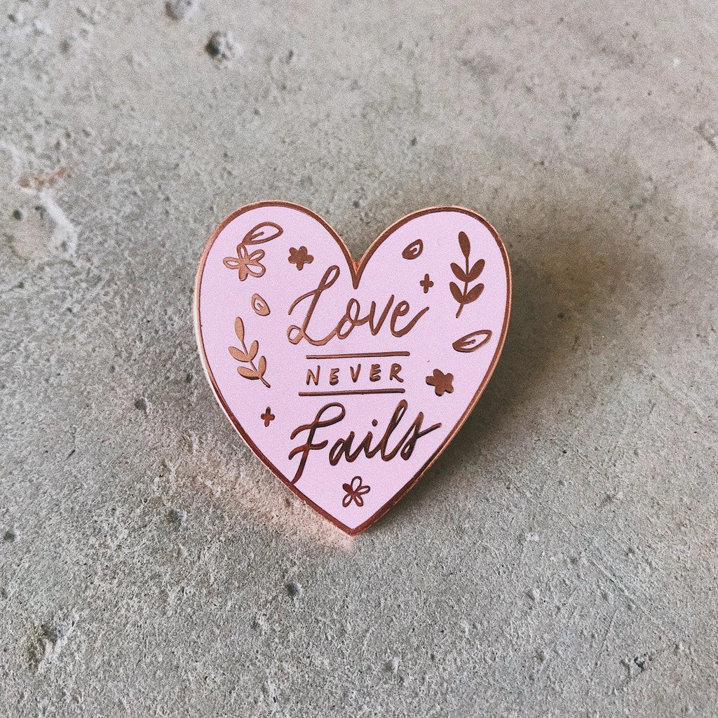 Love never fails enamel pin