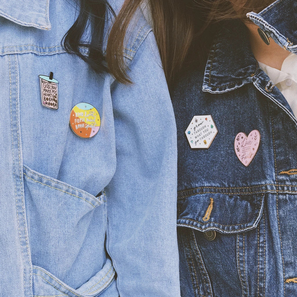 Carry a little positivity wherever you go. Wear the pins out proudly as part of your outfit ensemble.