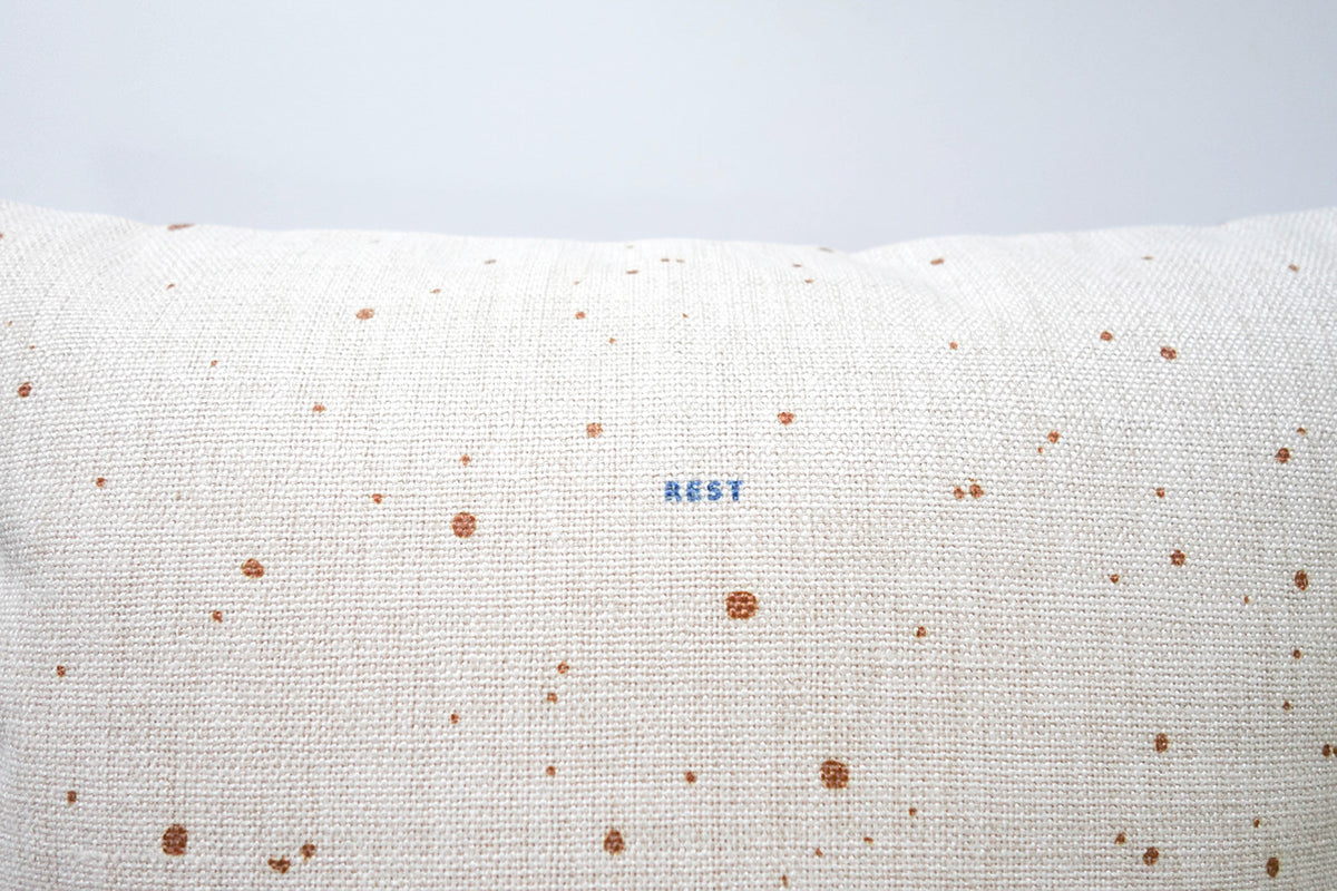 Close-up of the Rest Christian cushion cover cotton linen material