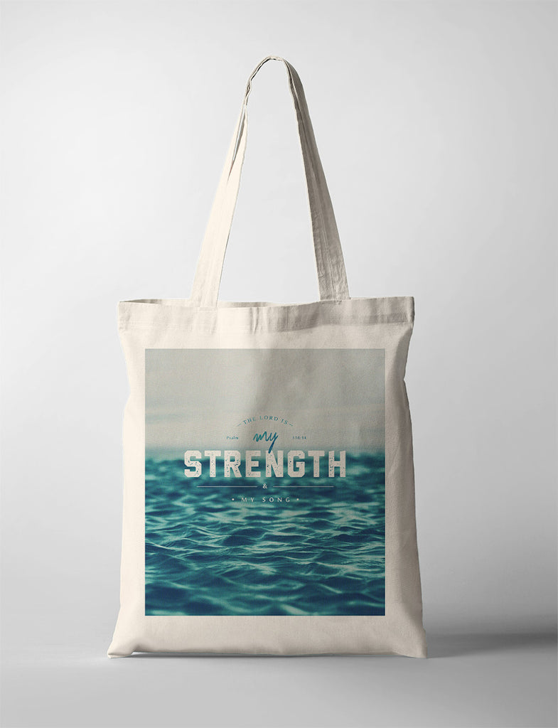 tote bag design that says "The lord is my strength & my song"