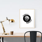 A3 beautiful calligraphy poster placed standing  on a wooden table. Modern Christian home interior design ideas.