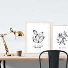 A3 beautiful calligraphy poster placed standing next to a smaller A4 sized calligraphy poster on a wooden table. Modern home interior design ideas.