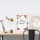 A3 beautiful calligraphy poster placed standing next to a smaller A4 sized calligraphy poster on a wooden table. Modern Christian home interior design ideas.