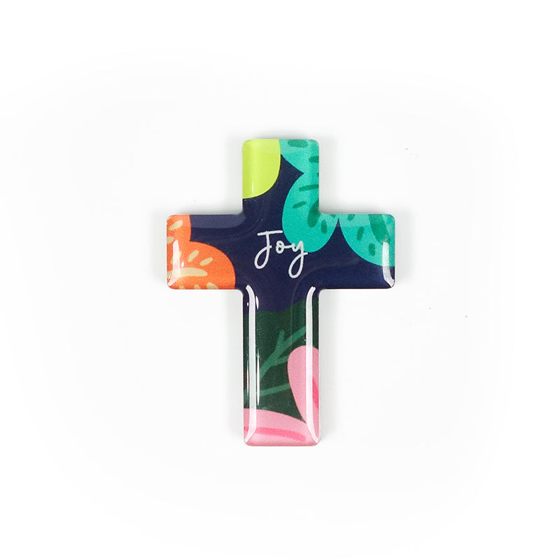 Cross acrylic magnet with colourful floral design. And the encouraging message 'Joy' in white.