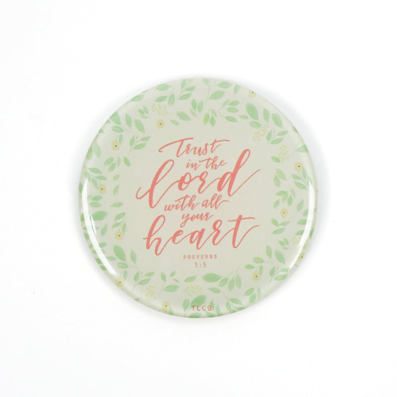 5.5 cm diameter circular Acrylic fridge magnet with bible verse “Trust in the Lord with all your heart” on foliage background.